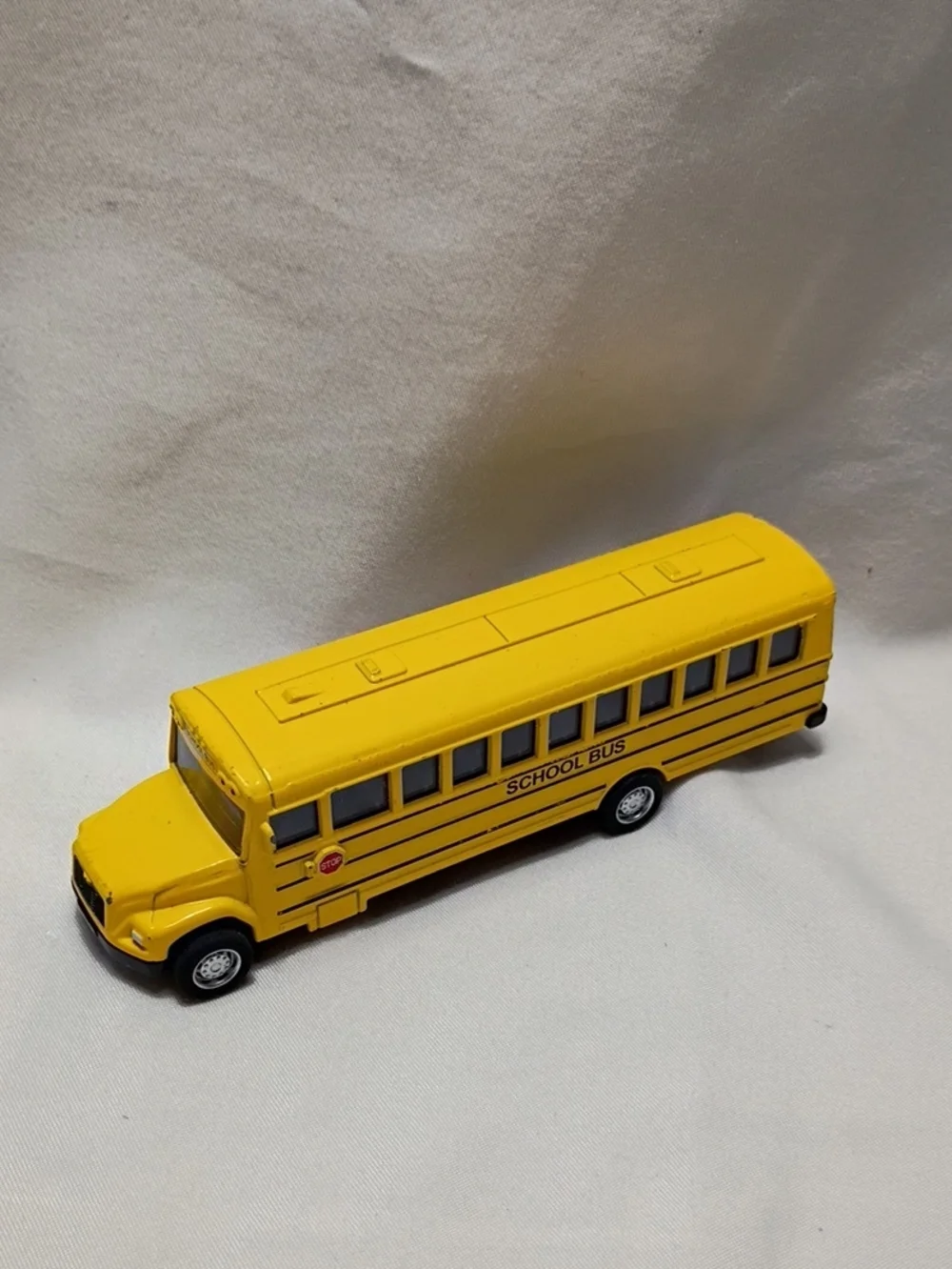 MB Wolverine Holding Yellow School Bus Toy Diecast